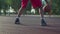 Man practicing basketball handling skill outroors