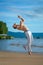 Man practicing capoeira on the beach. The man does the fighting element of capoeira.