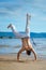 Man practicing capoeira on the beach. The man does the fighting element of capoeira.