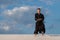 Man practicing Japanese martial art - iaido in the desert