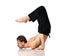 Man practicing yoga scorpion asana pose