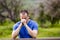 Man praying with his head down outside in nature.