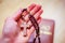 Man is praying: Rosary in the hands, holy bible in the background