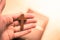 Man is praying: Rosary in the hands, holy bible in the background