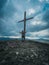 A man prays on a mountain in front of a cross-beautiful wallpaper