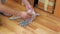 Man prepared bolts and nuts for collecting furniture at home, closeup hands.