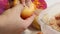 A man prepares bell peppers stuffed with minced meat and rice. Pours minced meat and rice into pepper. Close-up shot