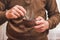 Man prepares coffee, useful drink during break in work_