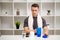 Man prepares a protein shake in the shaker after training.