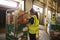 Man prepares and scans packages in a warehouse for delivery