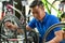 Man Preparing Bicycle for Selling