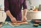 Man preparing grilled steak on the home kitchen