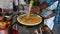 Man preparing pizza on a chapati.