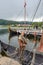 Man preparing Reconstructed Viking boat in the border of Innerpollen salty lake in Vestvagoy island of Lofoten archipelago. The