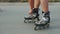 Man preparing for roller skating, putting on rollerskates