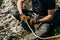 Man preparing rope in figure eight for rappelling