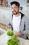 man preparing to spin washed lettuce