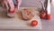 Man preparing traditional catalan recipe of bread with tomato