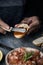 Man preparing a vegan appetizer, and tomato salad