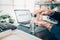 Man pressing hand sanitiser on his desk to wash his hands to prevent coronavirus. Clean hand concept