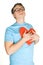 Man pressing to bosom red paper heart