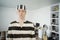 Man in Prisoner Uniform at Home. Lockdown Concept