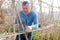 Man professional horticulturist working with wooden girders