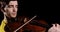 Man professional violinist plays alt or violin on black background, front view.