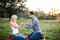 Man proposes to a girl in a park at a picnic