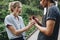 Man proposing to his happy girlfriend outdoors love and marriage concept