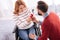 Man proposing to a joyful disabled woman