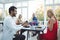 Man proposing woman while having meal