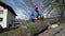 Man in protective clothes chainsawing wood