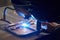 A man in a protective mask carries out welding work