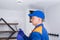 A man in a protective uniform, records the readings of the exhaust and sewer equipment