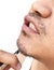Man pull mustache by tweezers on white background