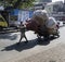 Man pulling a heavy loaded cart, Mumbai