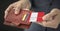 Man pulls credit card with flag of Peru out of his wallet, fictional card number