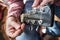 Man pulls new guitar strings acoustic guitar in closeup