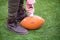 Man pumping air into american football ball