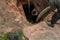 Man pumping sludge from a newly opened septic tank