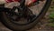 A man pumps a Bicycle wheel close up