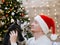 Man and puppy husky, Santa Claus hat, close up