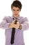Man in purple dress shirt with gun focused on face.