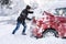 Man Pushing A Car Stuck In The Snow