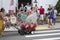 Man pushing giant oyster in the Wellfleet 4th of July Parade in Wellfleet, Massachusetts.