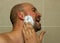 Man put shave foam, gel before he shaving his face with the razor blade. Men skin care concept