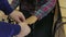 A man puts a female hands on the sensors lie detector test