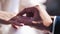 A man puts his woman wedding ring on his finger. very nice close-up. the moment of love and marriage