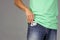 Man puts new condom in front pocket of jeans, concept of relationships based on trust and responsibility, copy space